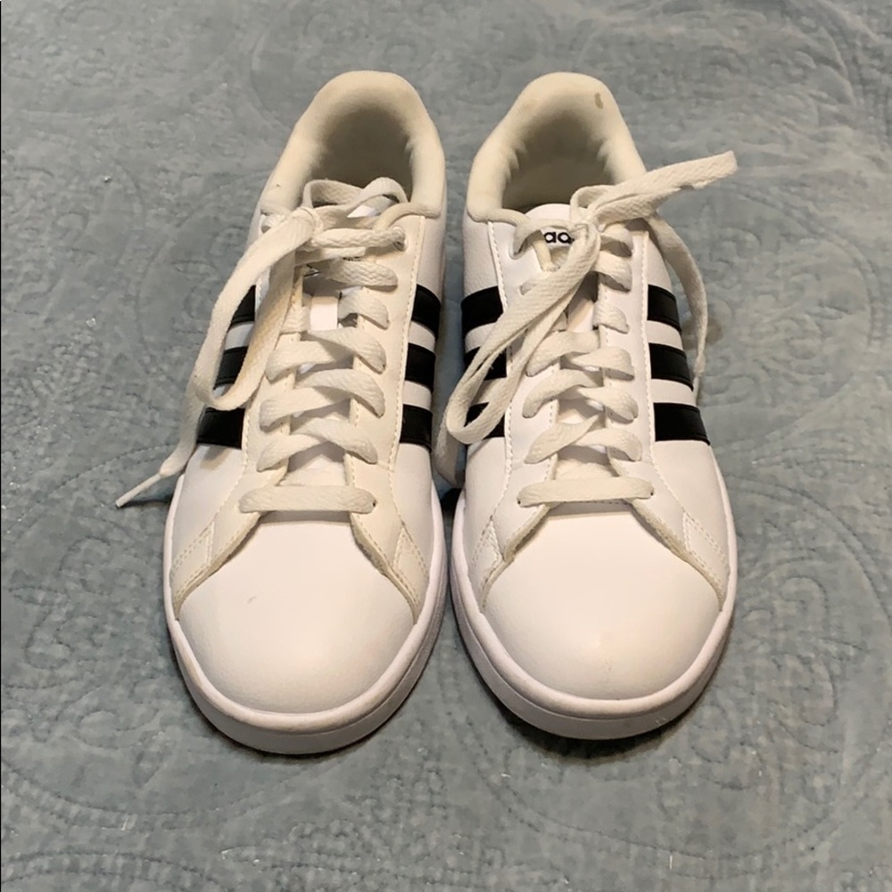 white and black adidas sneakers